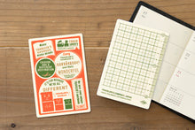 Laden Sie das Bild in den Galerie-Viewer, TRAVELER'S COMPANY - Traveler's Notebook Passport - 2027 Plastik Schreibunterlage